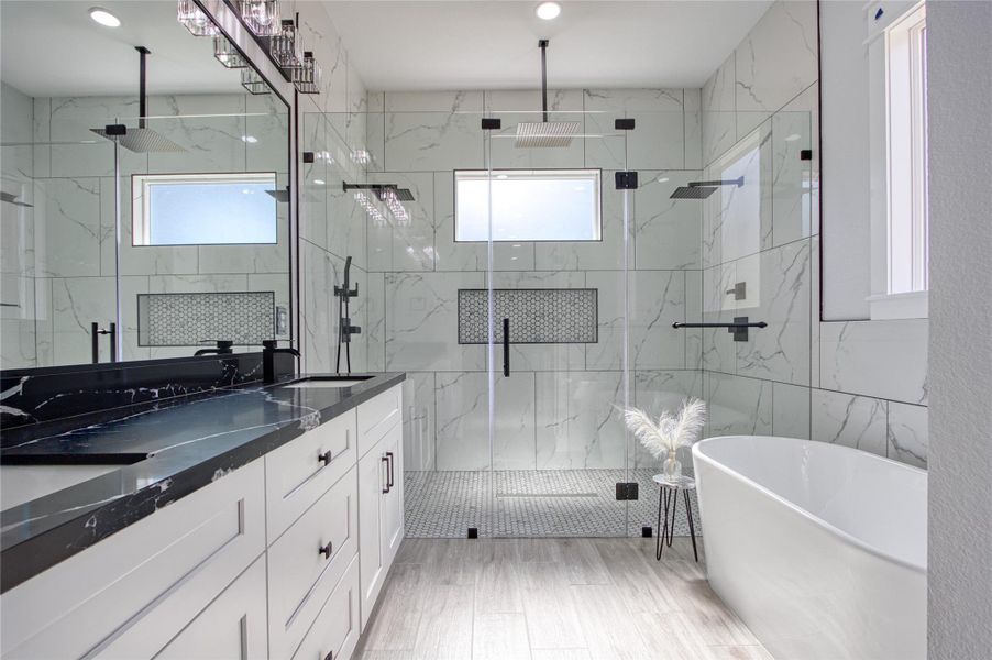 Primary bath features double sinks, plenty of cabinets and drawers, unbelievable shower with two shower heads and large soaking tub. Primary bath features double sinks, plenty of cabinets and drawers, unbelievable shower with two shower heads and large soaking tub.