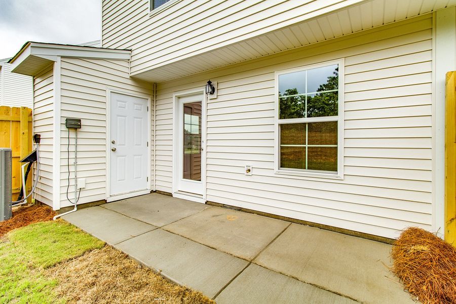 Exterior details and patio area of a home in Padgett Commons, Hopkins (Image 3).