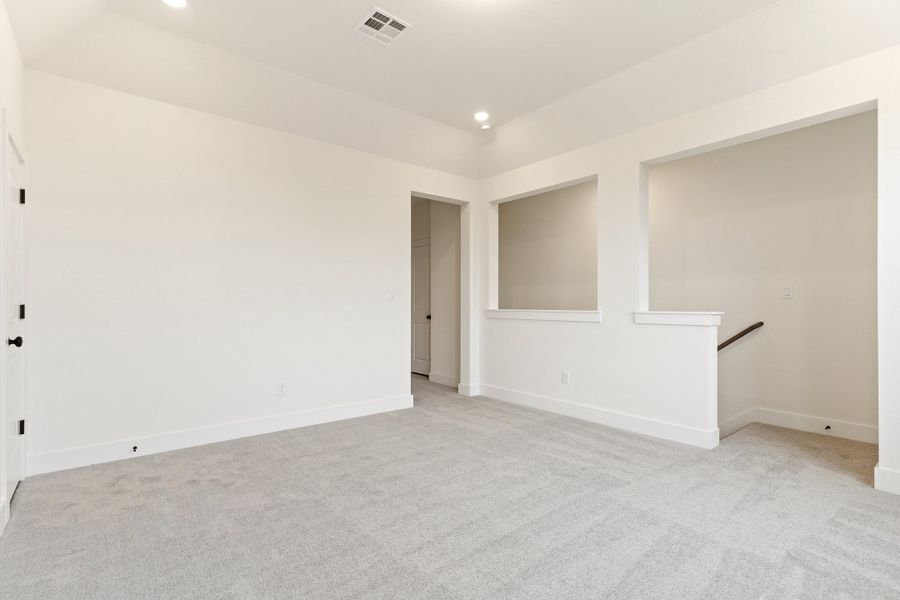 Representative unfurnished interior of a home built from the Waterville by Ashton Woods in The Trails at Carmel, Pflugerville (Image 54).