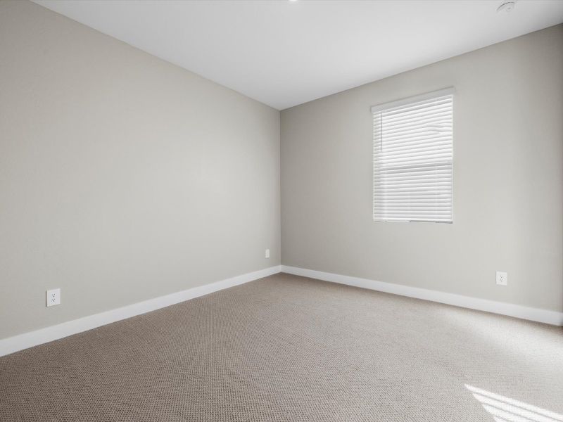 Spacious, unfurnished interior of a new home in Blossom Rock Reserve Series, Apache Junction (Image 12).