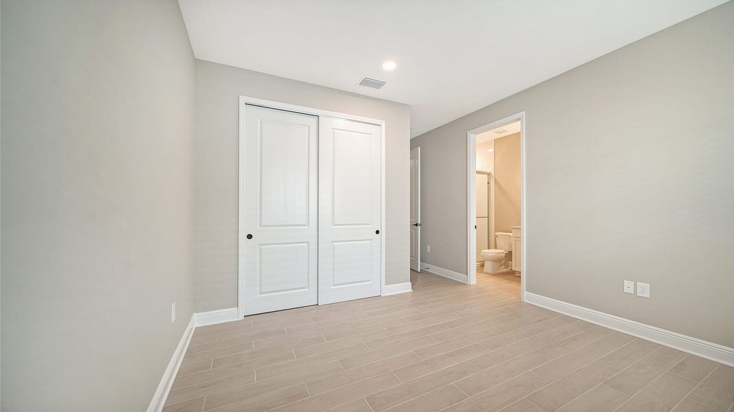 Spacious, unfurnished interior of a new home in Windward Real Estate and Homes for Sale in Sarasota, FL - Neal Communities, Lakewood Ranch (Image 33).