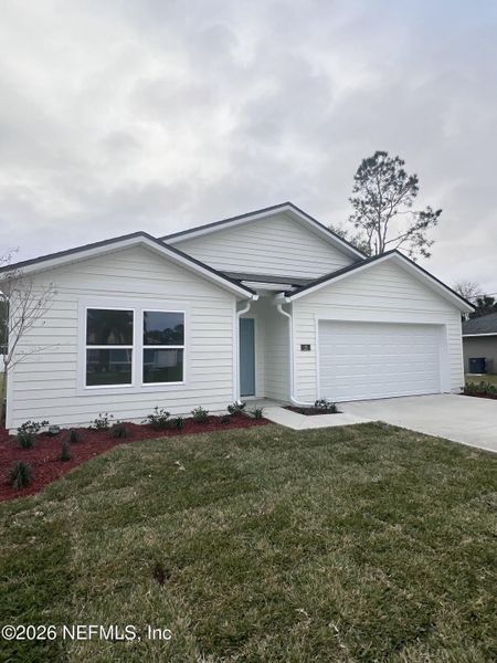 Front exterior of a new home in Palm Coast Homesites, Palm Coast, FL, highlighting curb appeal (Image 26).