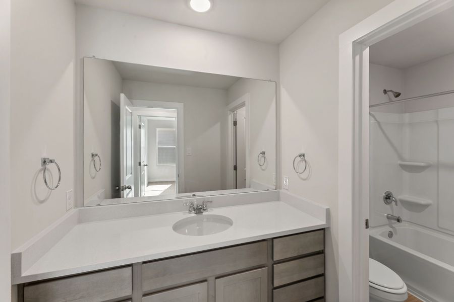 Representative furnished interior of a home built from the Poinseta by Hakes Brothers in Hickory Ridge, Elmendorf (Image 10). Representative furnished interior of a home built from the Poinseta by Hakes Brothers in Hickory Ridge, Elmendorf (Image 10).