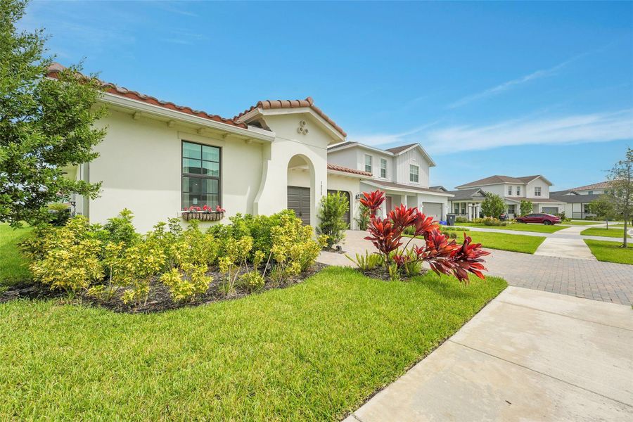 Front exterior of a new home in , Loxahatchee, FL, highlighting curb appeal (Image 24).
