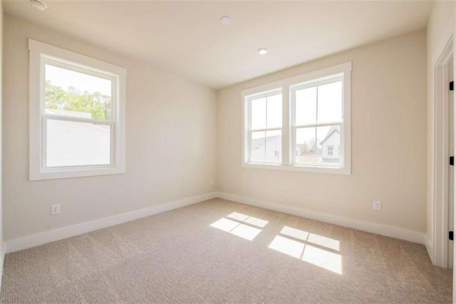 Spacious, unfurnished interior of a new home in The Paddocks at Doc Hughes, Buford (Image 42).