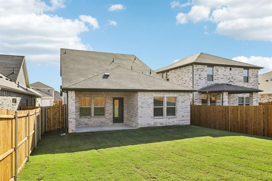 Exterior details and patio area of a home in Simpson Crossing - Spring Series, McKinney (Image 3). Exterior details and patio area of a home in Simpson Crossing - Spring Series, McKinney (Image 3).