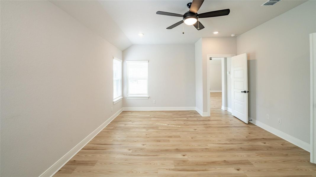 Unfurnished bedroom with light wood finished floors, a ceiling fan, and recessed lighting Unfurnished bedroom with light wood finished floors, a ceiling fan, and recessed lighting