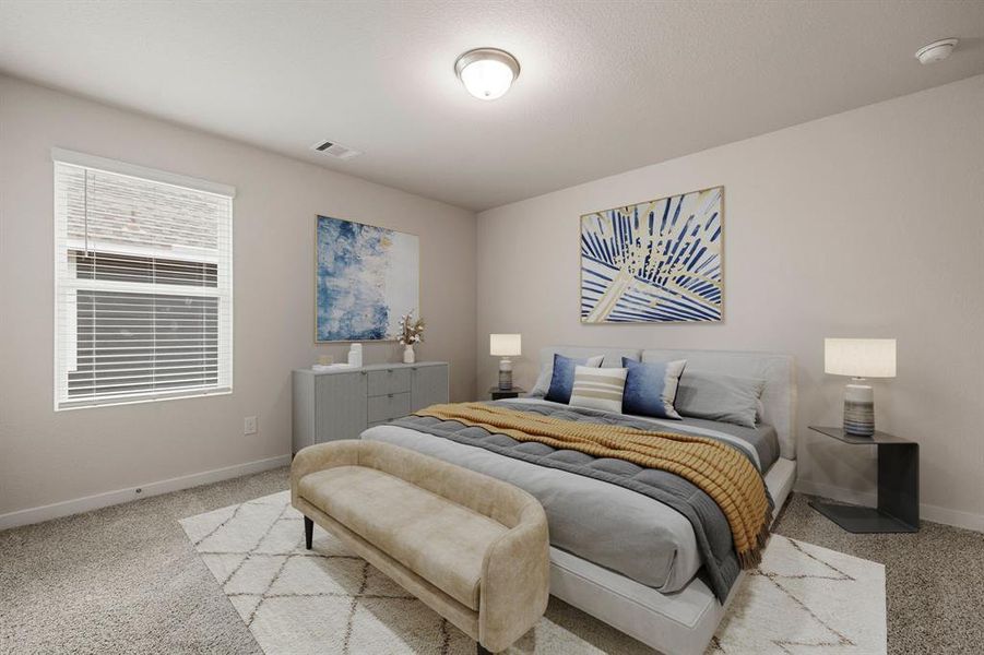 Secondary bedroom features plush carpet, neutral paint, lighting and a large window with privacy blinds.