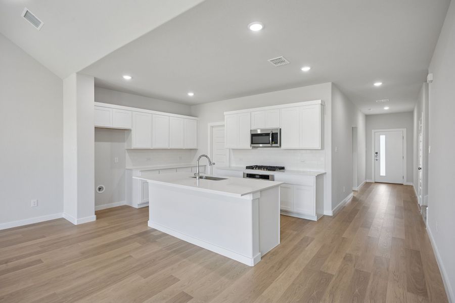 Kitchen in the Masters home plan by Trophy Signature Homes – REPRESENTATIVE PHOTO