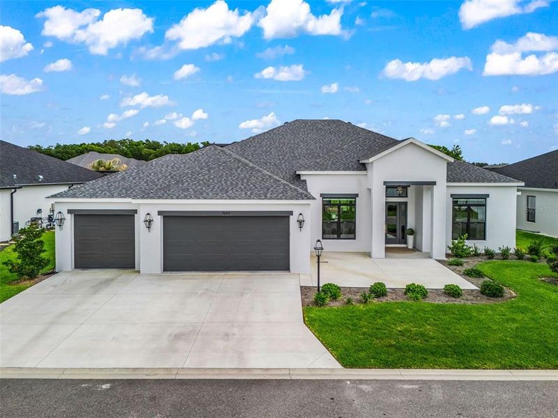 Front exterior of a new home in , The Villages, FL, highlighting curb appeal (Image 25). Front exterior of a new home in , The Villages, FL, highlighting curb appeal (Image 25).