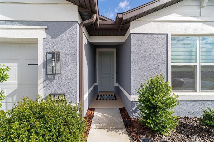 Exterior details and patio area of a home in Del Webb Stone Creek, Ocala (Image 1).