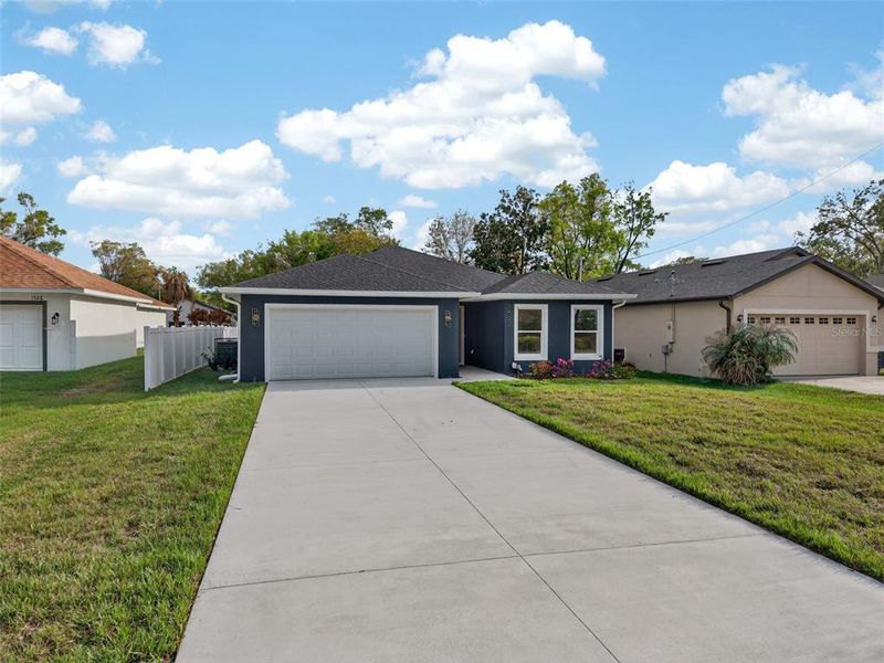 Front exterior of a new home in , Orlando, FL, highlighting curb appeal (Image 26).
