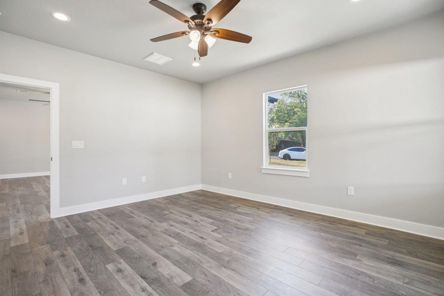 Empty room featuring recessed lighting, wood finished floors, and ceiling fan