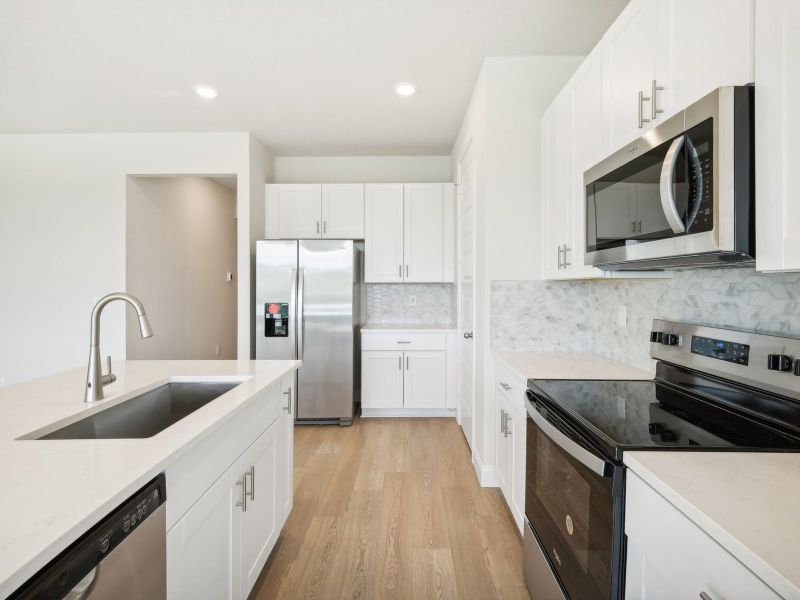 Kitchen in the Bergamo floorplan at 11306 NW Firefly Court