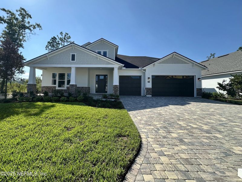 Front exterior of a new home in SilverLeaf, St. Augustine, FL, highlighting curb appeal (Image 19). Front exterior of a new home in SilverLeaf, St. Augustine, FL, highlighting curb appeal (Image 19).