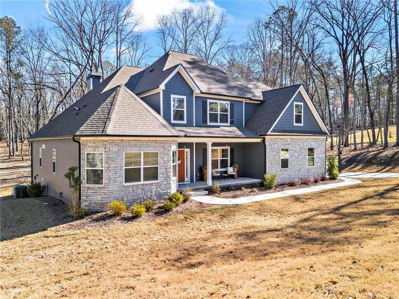 Front exterior of a new home in Dorsett Bridge, Douglasville, GA, highlighting curb appeal (Image 22).