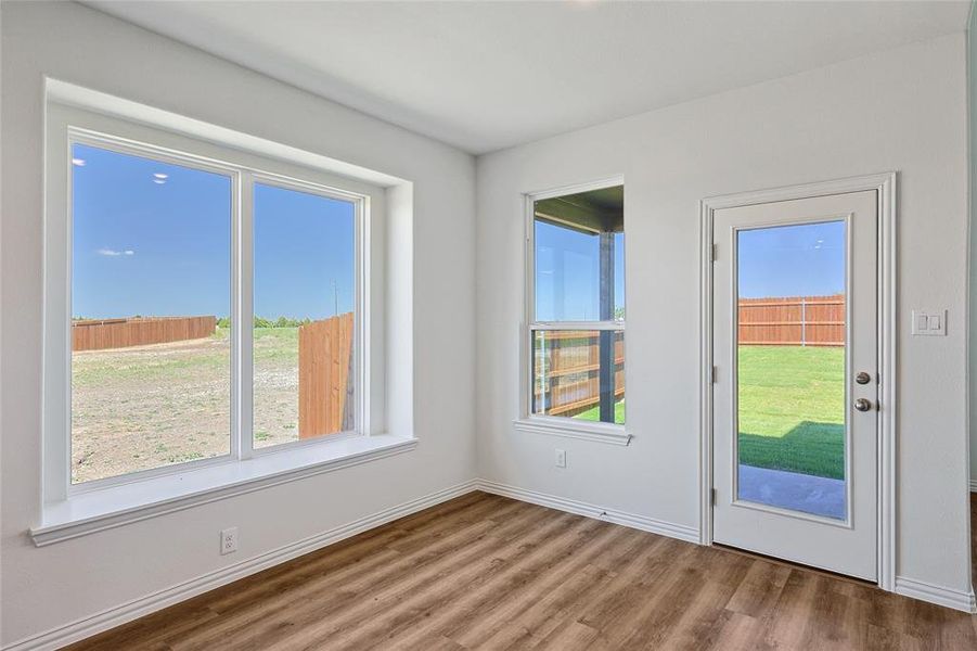 Doorway with hardwood / wood-style floors