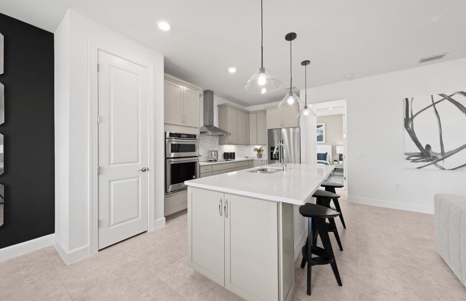 Kitchen with built-in stainless steel appliances