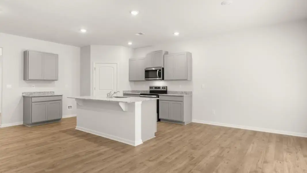 Furnished interior view inside a new home in Oaks at Cedar Grove, Fairburn (Image 4).