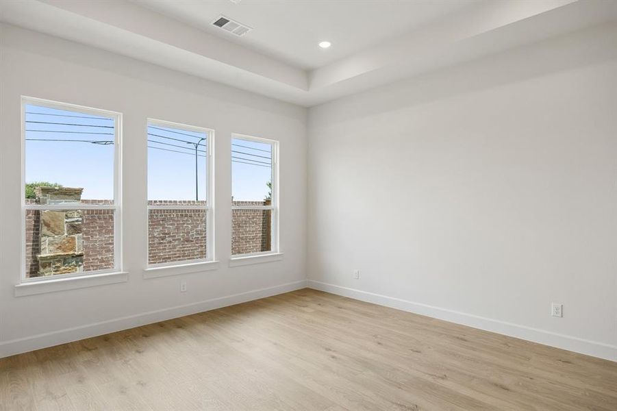Located at the rear of the home for additional privacy, this owner's suite was designed for rest and relaxation.