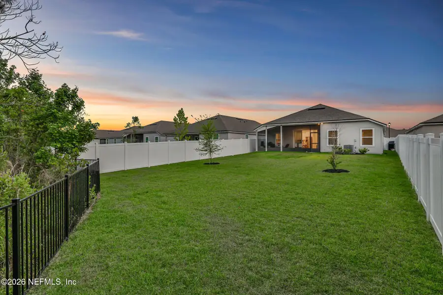 Exterior details and patio area of a home in Cross Creek, Green Cove Springs (Image 3).