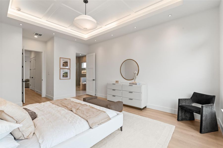 From the bed, you can see straight into the en suite, keeping the whole primary wing feeling open and connected rather than closed off in separate boxes. It's a layout that makes morning routines feel easy