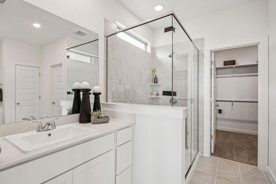 Primary Bathroom in the Trinity home plan by Trophy Signature Homes – REPRESENTATIVE PHOTO