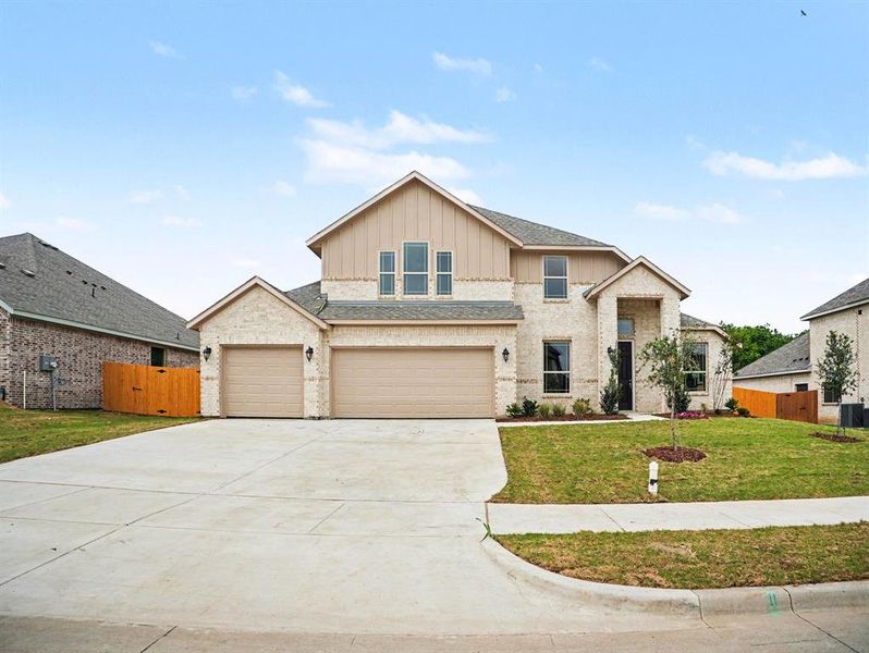 Front exterior of a new home in Cole Crossing Estates, DeSoto, TX, highlighting curb appeal (Image 16).