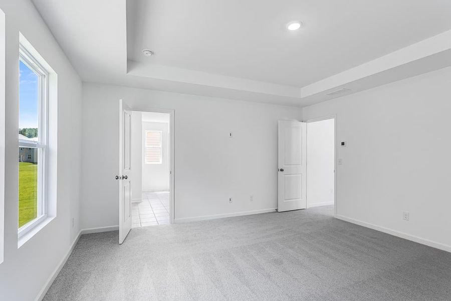 Representative unfurnished interior of a home built from the Avera by Taylor Morrison in Falls Creek, Flowery Branch (Image 24).