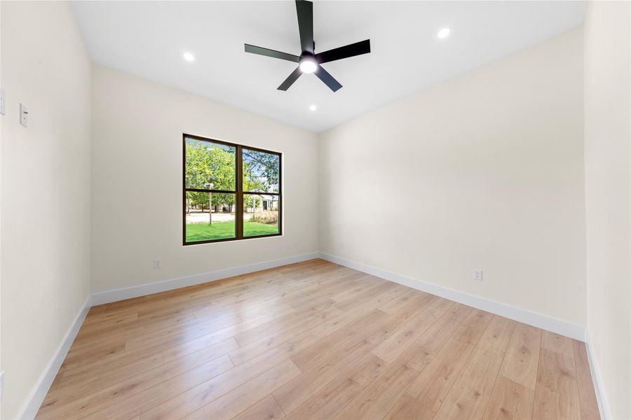 Spare room featuring light wood finished floors, recessed lighting, and a ceiling fan Spare room featuring light wood finished floors, recessed lighting, and a ceiling fan