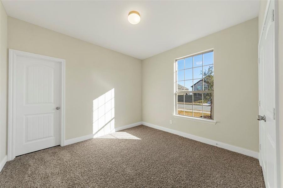 Unfurnished room featuring carpet floors