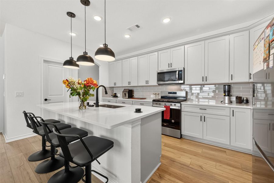 Furnished interior view inside a new home in Sunterra, Katy (Image 14).