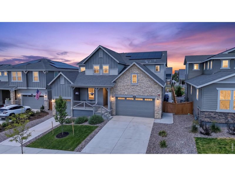Front exterior of a new home in Sunset Village, Erie, CO, highlighting curb appeal (Image 22).