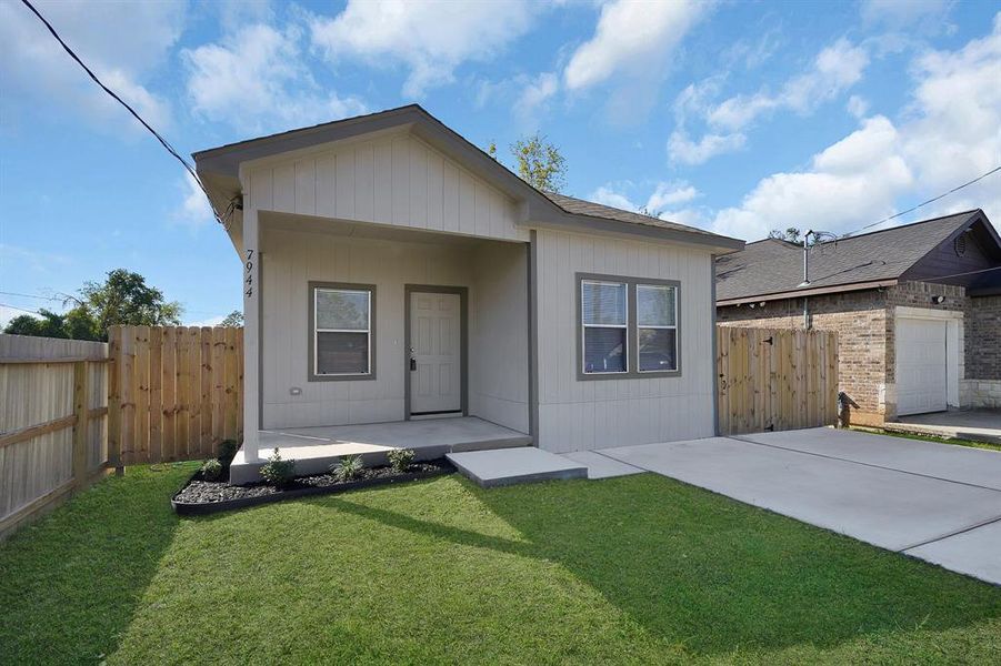 Covered front porch with double wide driveway