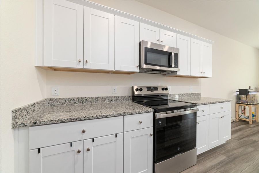 Furnished interior view inside a new home in Sunterra, Katy (Image 9).