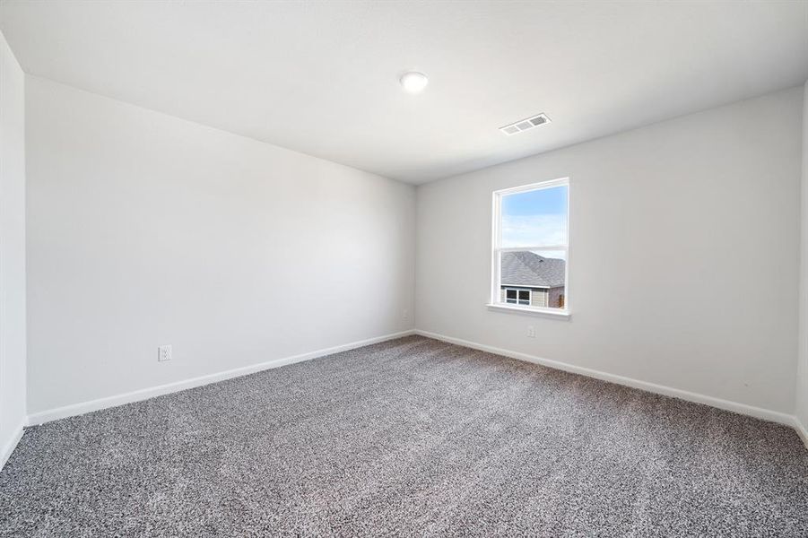 Empty room featuring carpet flooring