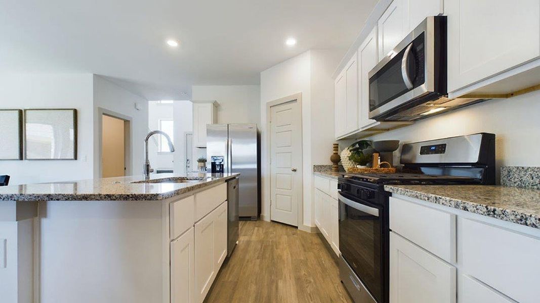 Representative furnished interior of a home built from the The Pierce by D.R. Horton in Overlook West, Wolfforth (Image 8).