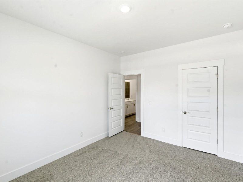 Spacious, unfurnished interior of a new home in The Coves at Lakes of Cane Bay II, Summerville (Image 32).