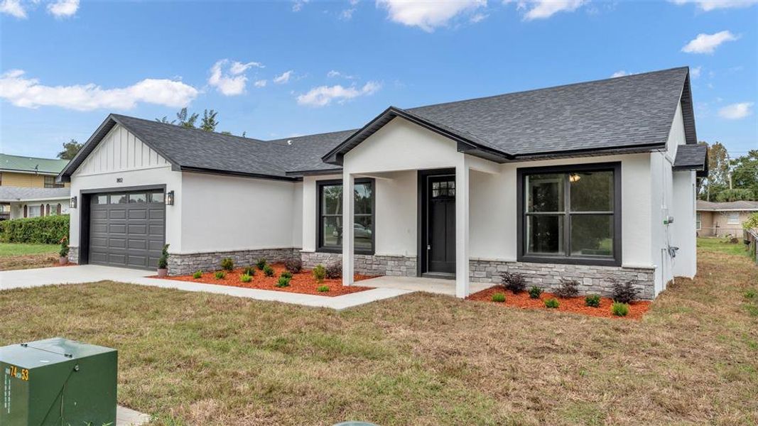 Front exterior of a new home in , Winter Haven, FL, highlighting curb appeal (Image 21). Front exterior of a new home in , Winter Haven, FL, highlighting curb appeal (Image 21).