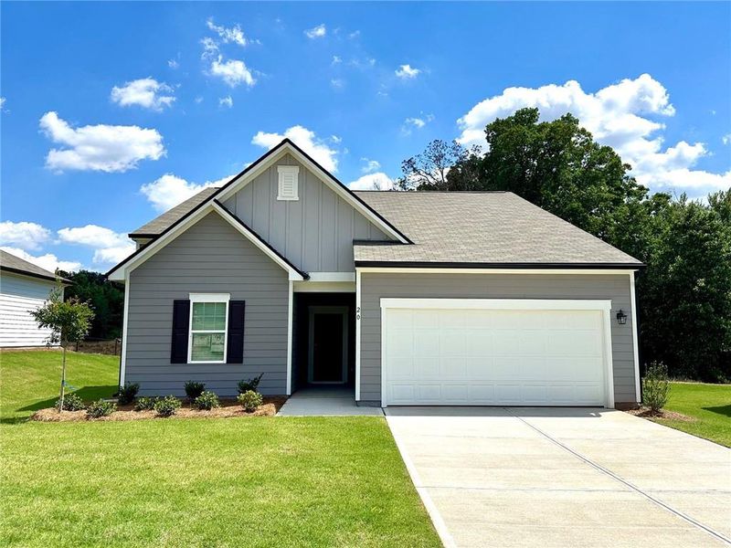 Front exterior of a new home in Crescent Pointe, Carrollton, GA, highlighting curb appeal (Image 1). Front exterior of a new home in Crescent Pointe, Carrollton, GA, highlighting curb appeal (Image 1).