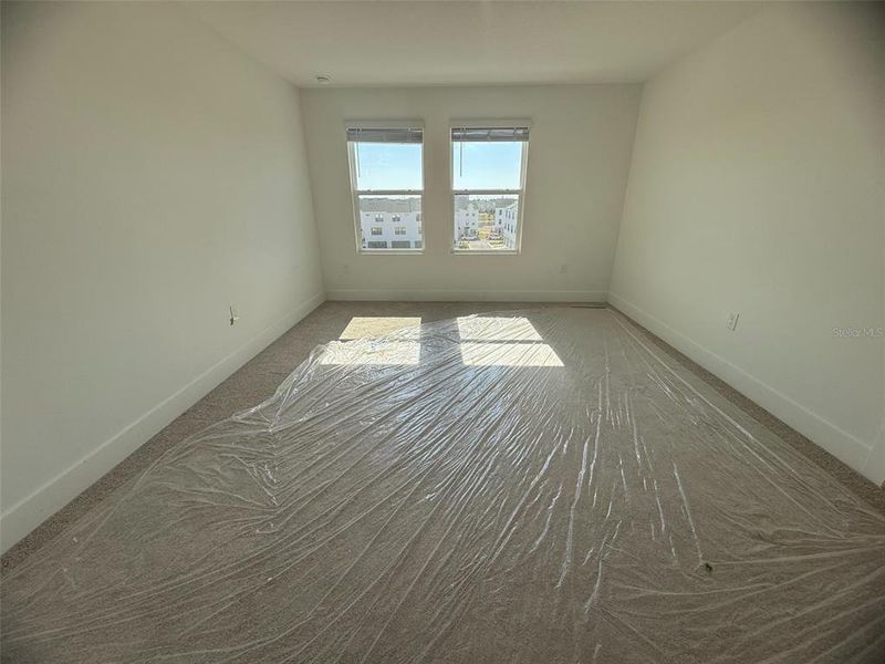 Spacious, unfurnished interior of a new home in Parkview at Hamlin, Winter Garden (Image 14).