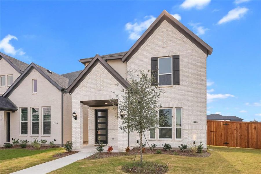 Front exterior of a new home in Symmetry 37s, Frisco, TX, highlighting curb appeal (Image 29).