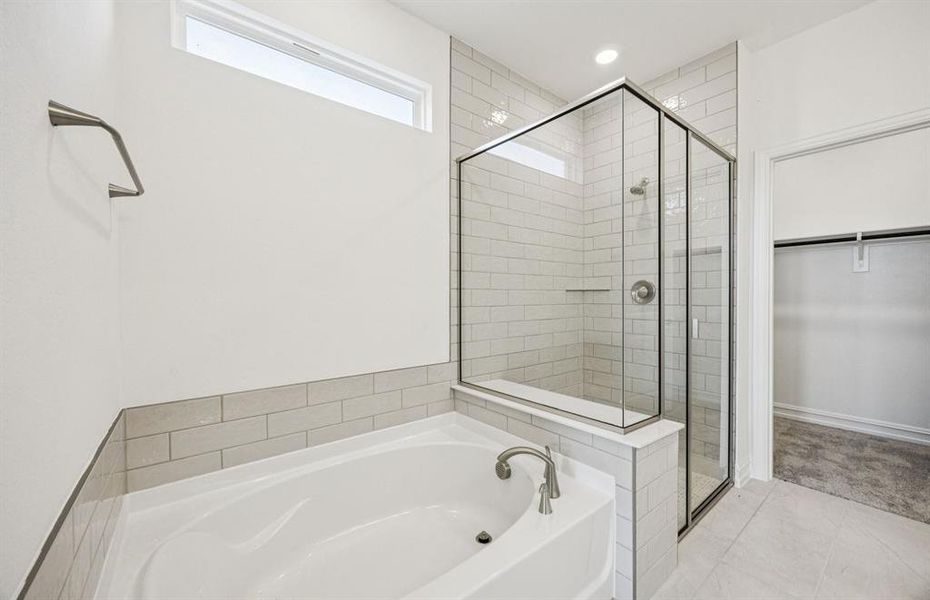 Owner's bath designed with a double vanity and oversized shower *Real home pictured Owner's bath designed with a double vanity and oversized shower *Real home pictured