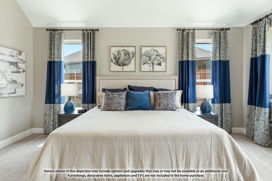 Bedroom with king bed, upholstered headboard, navy curtains, and two windows with natural light Bedroom with king bed, upholstered headboard, navy curtains, and two windows with natural light