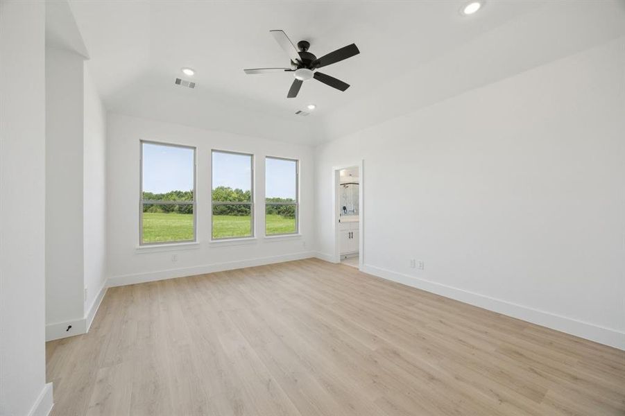 Empty room featuring light wood-type flooring, recessed lighting, and a ceiling fan Empty room featuring light wood-type flooring, recessed lighting, and a ceiling fan