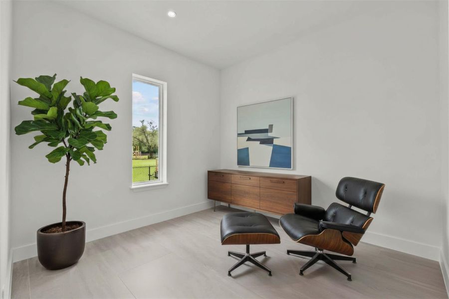Located within the primary suite, this 11.4 x 11 room can be used as a secondary primary closet, a home gym, or home office.