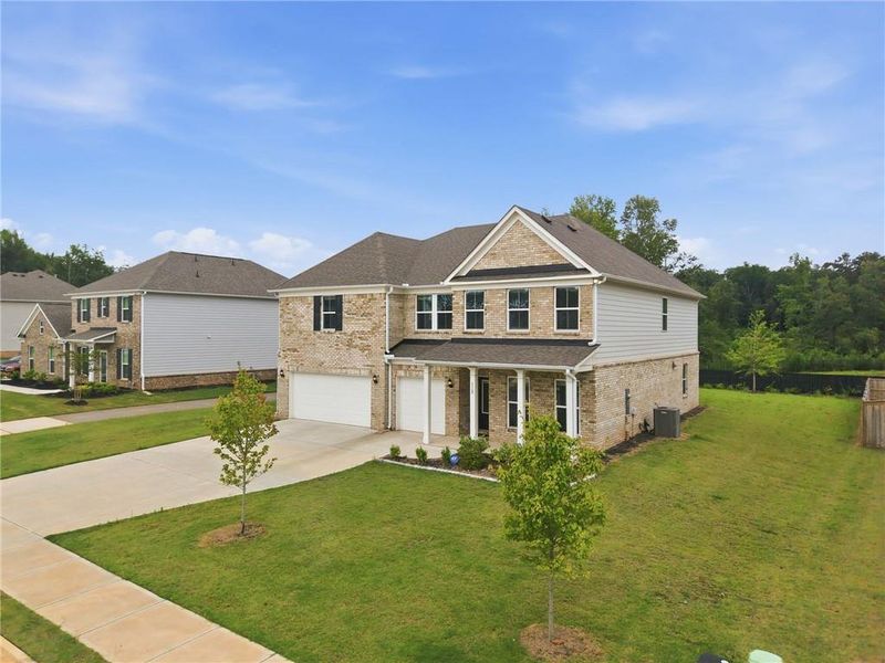 Front exterior of a new home in , McDonough, GA, highlighting curb appeal (Image 31). Front exterior of a new home in , McDonough, GA, highlighting curb appeal (Image 31).