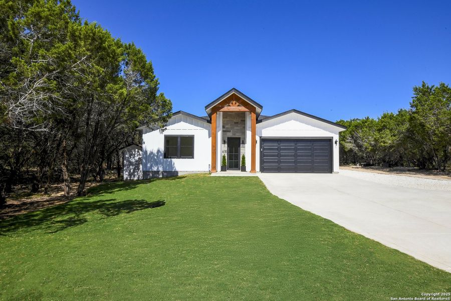 Front exterior of a new home in , Boerne, TX, highlighting curb appeal (Image 15).