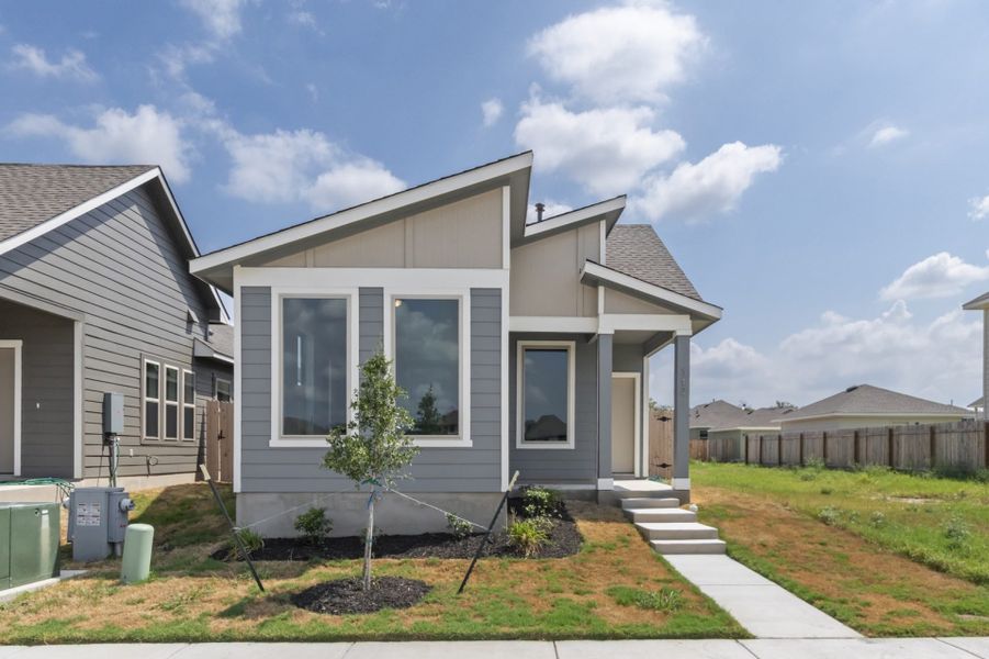 Front exterior of a new home in Blanco Vista, San Marcos, TX, highlighting curb appeal (Image 22).
