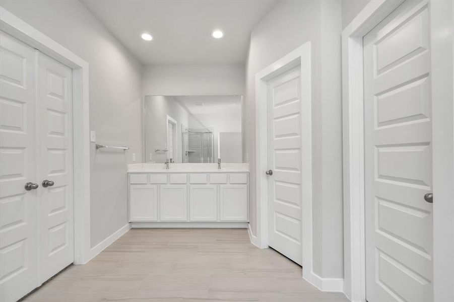 Experience luxury in this spa-like primary bathroom. Sample photo of completed home with similar floor plan. As-built interior colors and selections may vary.